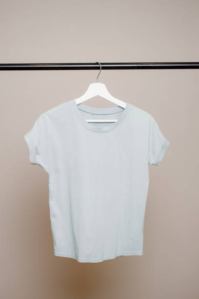 istock Blue T-shirt on a neutral background. Design concept. Copy space 1364925437