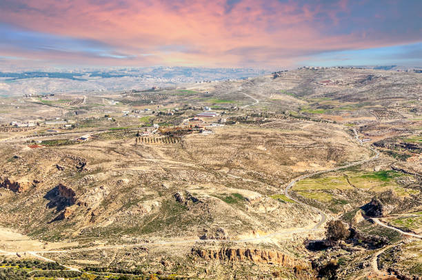 Mount Nebo at sunset Mount Nebo in Jordan at sunset. Mount Nebo is a peak of 817 meters. mount nebo jordan stock pictures, royalty-free photos & images