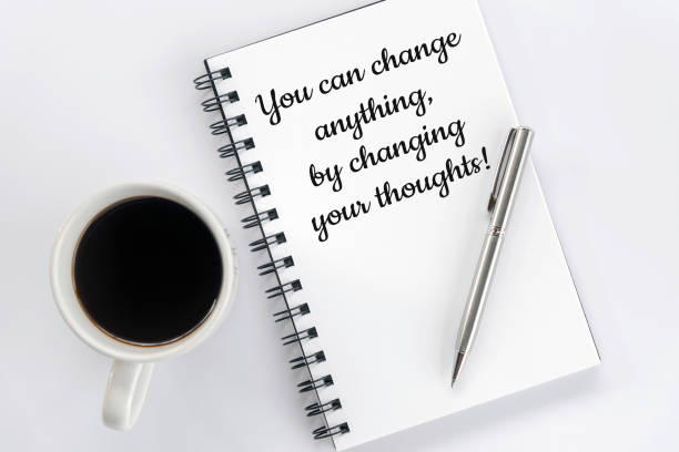 istock Positive handwritten motivational message on a notebook - You can change anything, by changing your thoughts. 1364927792