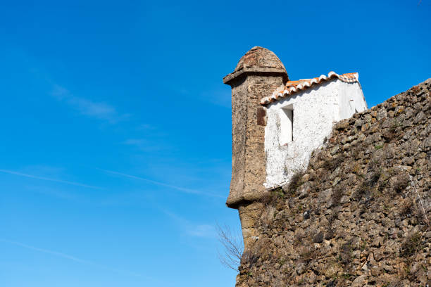 fortress lookout with small house beside in castelo de vide portugal. - castelo de vide imagens e fotografias de stock