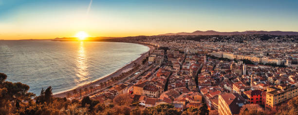 panoramic view of the city of nice at sunset, on the cote d azur, french riviera, france. - city of nice france french riviera promenade des anglais imagens e fotografias de stock