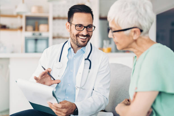 istock Doctor discussing patient's medical record 1364930003