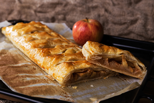 Homemade puff pastry pie filled with apple and cinnamon