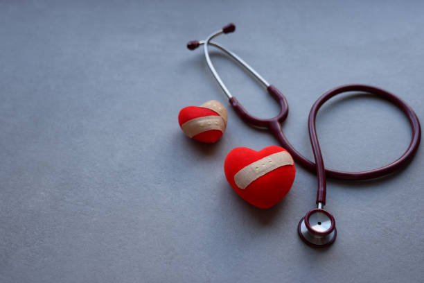 istock Red heart and stethoscope on gray background. 1364933669
