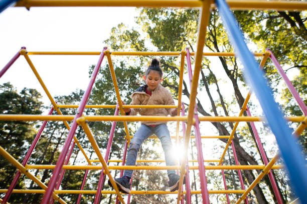 istock Girl playing in the winter park 1364935478
