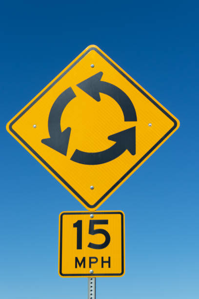 Round about traffic sign limiting the speed of entering cars