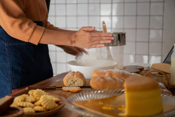 istock Woman cooking and baking cake in kitchen alone happily. 1364937885