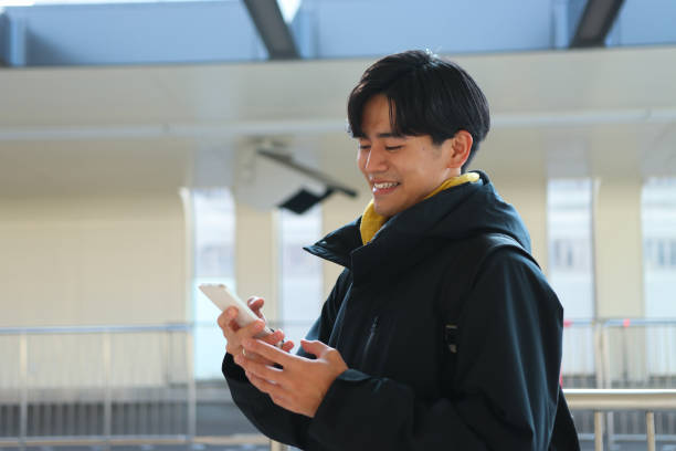 istock Young man is waiting for public transportation to arrive 1364937918