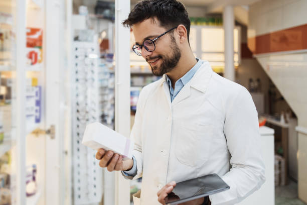 istock Young female pharmacist working in drugstore 1364939987
