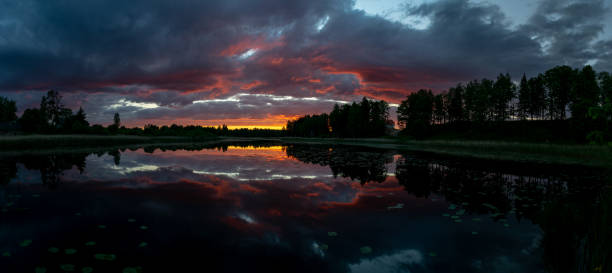 istock panoramic view, gorgeous and colorful sunset landscape on the lake 1364941595
