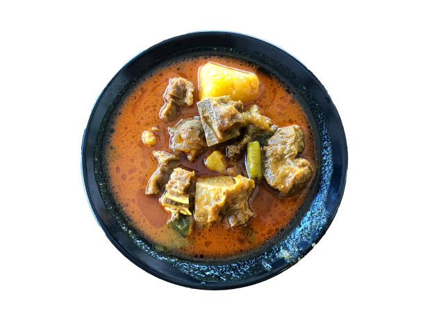 istock Mutton curry in a black plate isolated on a white background. Special dish in mamak restaurant 1364943835