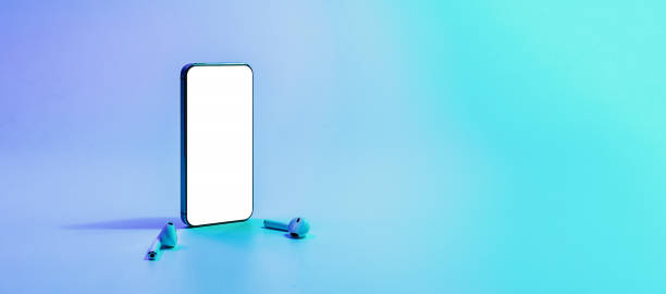 istock Mockup app. Mobile smartphone technology blank screen. Mock up smart phone device, audio headphones equipment on neon gradient banner. Game design, mobile application presentation, portfolio mockups. 1364945689