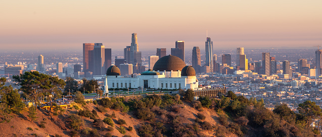 Los Angeles city skyline and Griffith Observatory at sunset, California