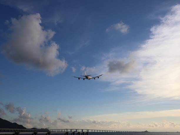 istock Airplane fly across the sky 1364945828