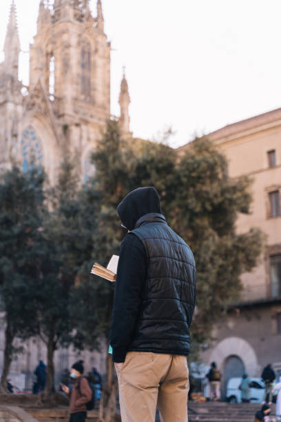istock Man reading the book in his hands. 1364950396