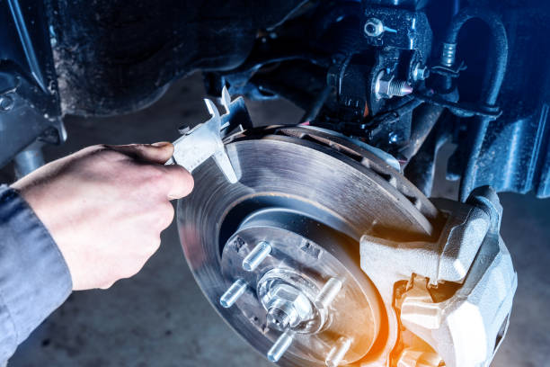 checking the brake discs wear with calipers. - travão imagens e fotografias de stock