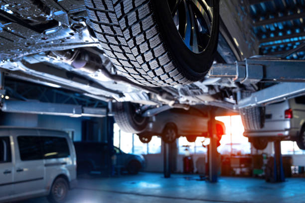 Auto service interior background with cars on the lift. stock photo