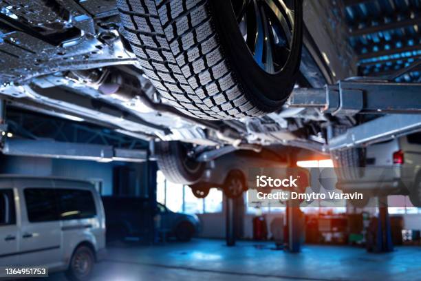 Auto Service Interior Background With Cars On The Lift Stock Photo - Download Image Now