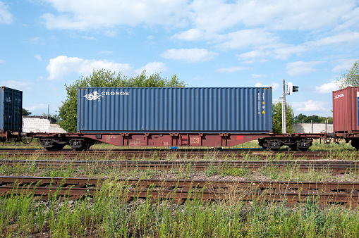 Brest / Belarus - July 20, 2015.\n\nFitting platform type Sgns 681 from DB Schenker Rail Deutschland at Brest-Northern station of Belarusian Railway.