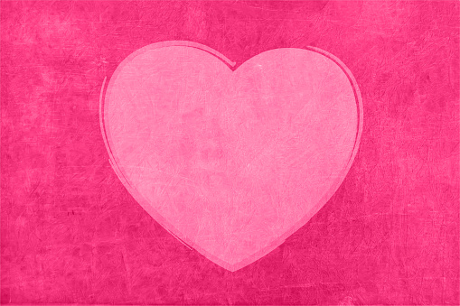 A bright pink coloured heart over dark fuschia grunge romantic background and empty or blank space all around.  Apt for love, valentine's day, Anniversary Greeting cards, backdrops, banners or posters with copy space for text.