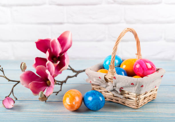 Easter. Basket with painted Easter eggs and chicks