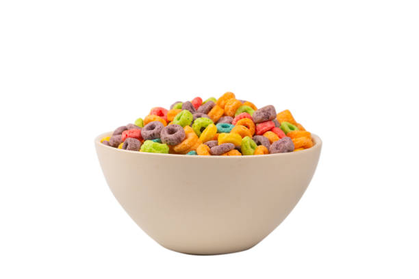 istock Colorful rings cereal spill out into a bowl. Breakfast. Isolated. 1364957367
