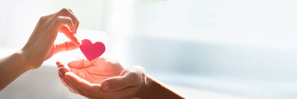istock Woman Giving Heart On Man's Hand 1364959070