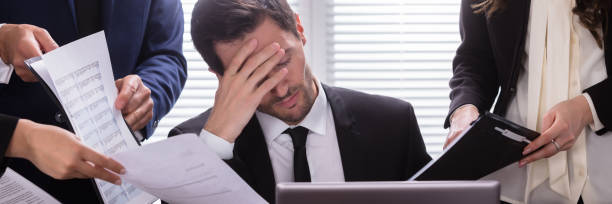 istock Stressed Businessman Sitting In Office 1364959125