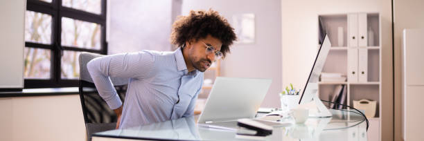 istock Back Pain Bad Posture Man Sitting 1364960368