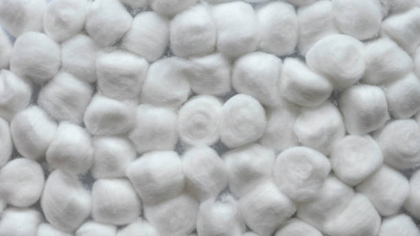 White cotton balls background and texture. stock photo