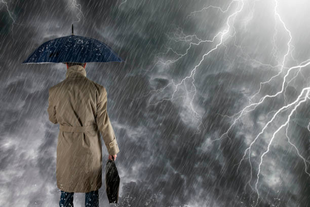 istock The man with  umbrella after an  storm, he is wet and dripping. 1364968039