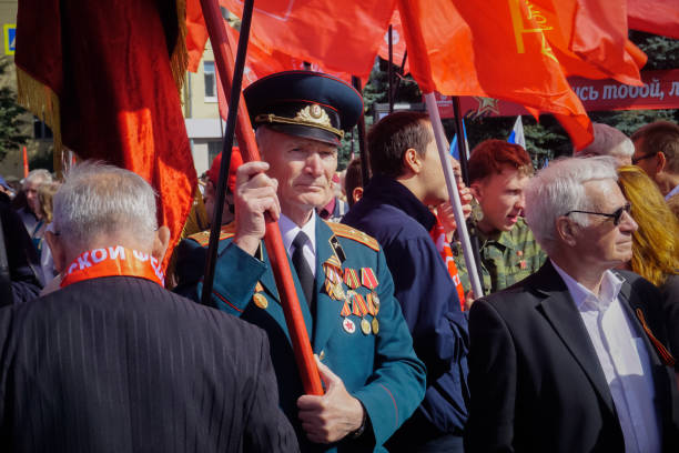 Bryansk, Russia - September 17, 2018: Old war veteran with a flag at a military parade