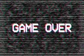Game Over pixel text, glitch effect background