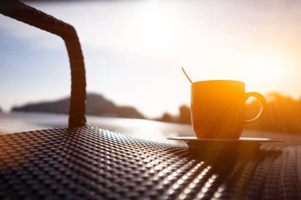 istock Coffee in a cup with the warm morning sea 1364971751