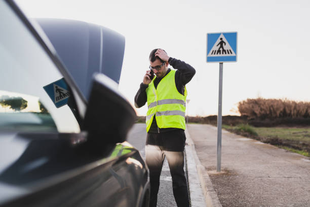 istock Man with car breakdown calling the assistance tow truck. 1364971829