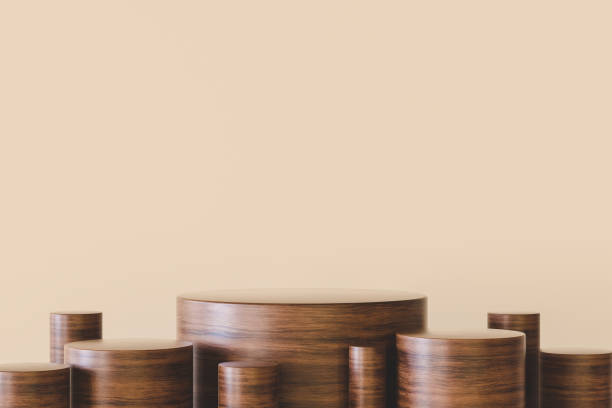 istock 3d illustration. Wooden cylindrical podiums on beige background 1364973062