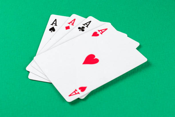 istock Playing cards on green background. 1364974343