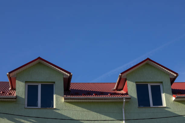 istock New roofing construction with attic skylights, rain gutter system, roof windows and roof protection from snow board, snow guard exterior 1364974498