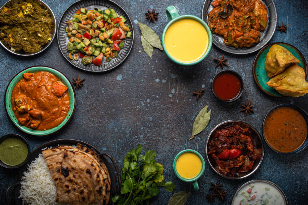 istock Indian ethnic food buffet on concrete table from above copy space 1364975901