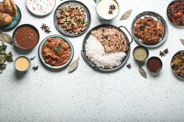 istock Indian ethnic food buffet on white concrete table top view copy space 1364975924