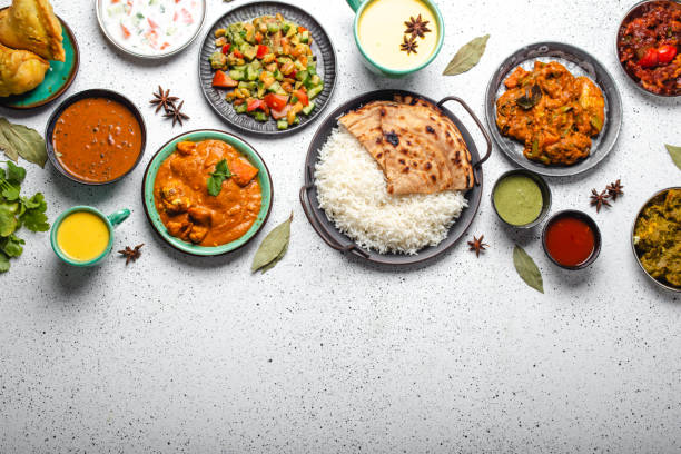 istock Indian ethnic food buffet on white concrete table top view copy space 1364975931