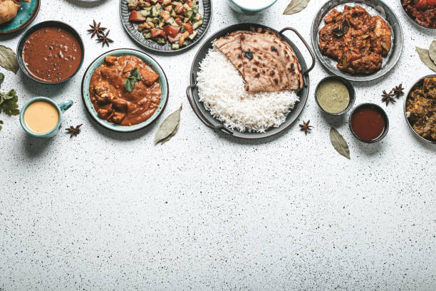 istock Indian ethnic food buffet on white concrete table top view copy space 1364975932