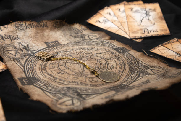 istock Ancient esoteric witchcraft background. Occultims and paganism old symbol, with mysterious runes alphabet 1364975961