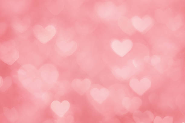Defocused pink hearts background stock photo