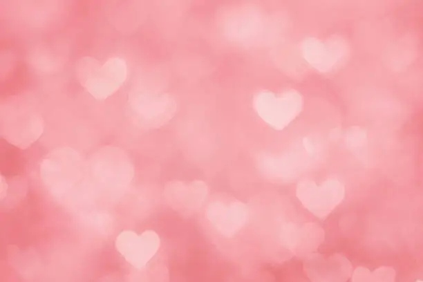 Photo of Defocused pink hearts background
