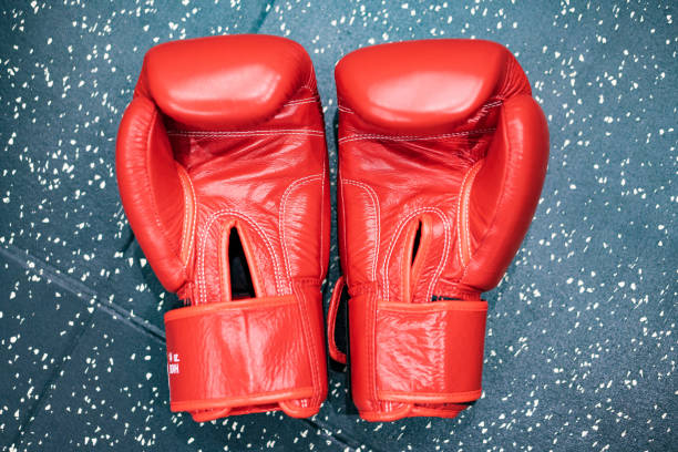 istock Red boxing gloves on the floor 1364976818