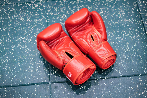 istock Red boxing gloves on the floor 1364977433