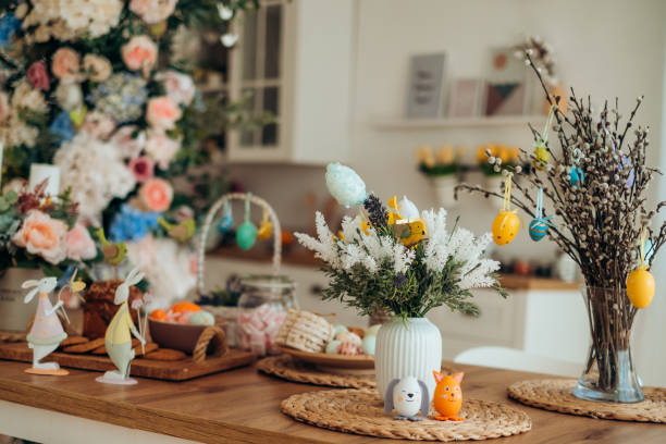 istock Easter decor on a wooden table and Easter bunny cake, Easter cake on a wooden tray, spring flowers, sweet table for the holiday, Easter holiday 1364978244