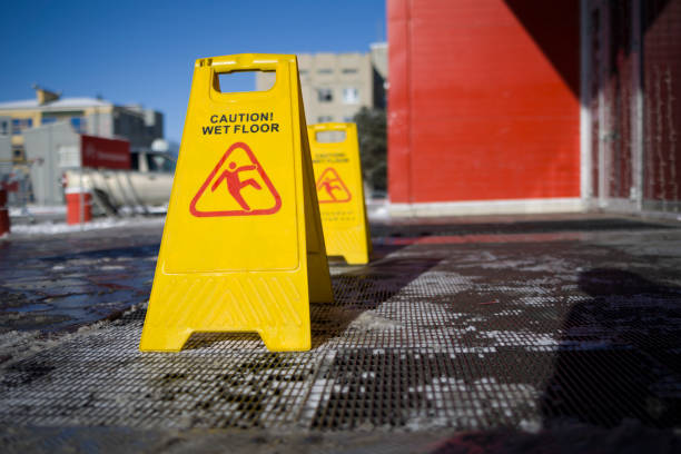 istock Wet floor caution sign.  danger sign in a shopping mall 1364980146