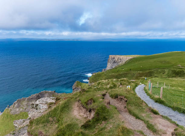 istock cliffs at irish coast with ocean and green fields 1364982534